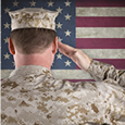 image of army personnel saluting the American flag